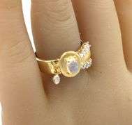 18kt Yellow gold oval moon stone and bezel diamond charm ring