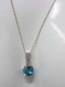 10kt White gold blue topaz and diamond pendant on chain