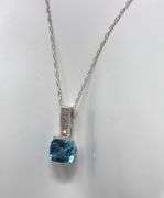 10kt White gold blue topaz and diamond pendant on chain