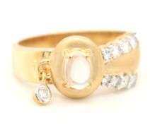 18kt Yellow gold oval moon stone and bezel diamond charm ring