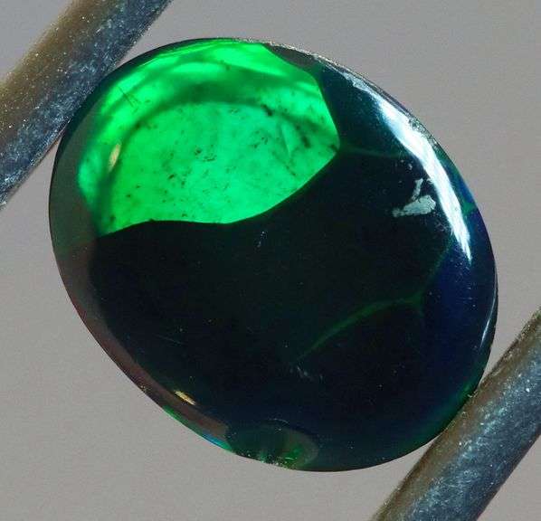 Block flashing 1.87ct black Opal cabochon