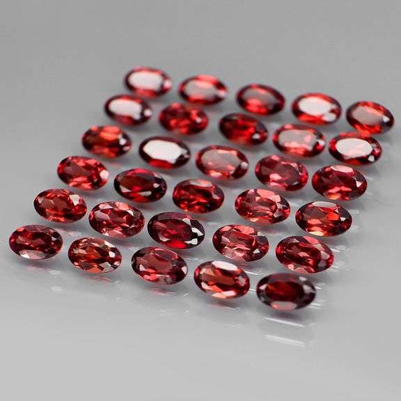 Amazing 8.67ct oval cut red Garnet set