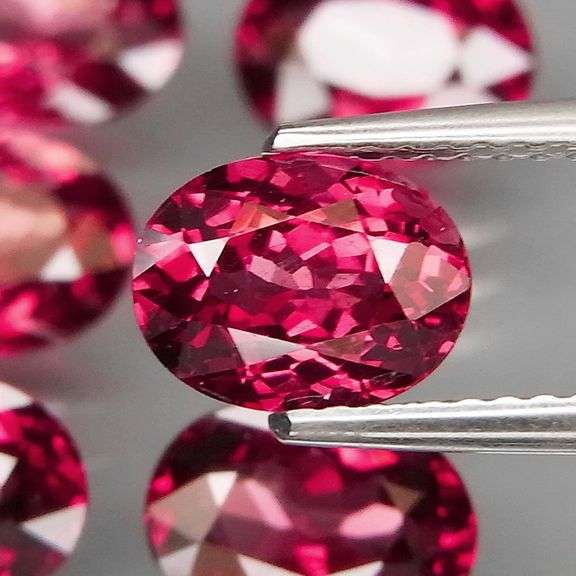Amazing 8.96ct oval cut violet red Garnet set
