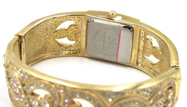 Isacc Mizrahi gold tone and Rhinestone hinged bangle bracelet watch