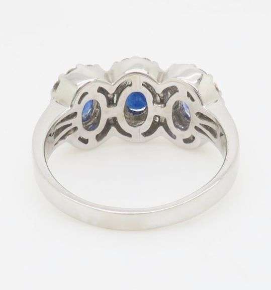 Three Stone Blue Sapphire & Diamond Halo Ring in 18k White Gold