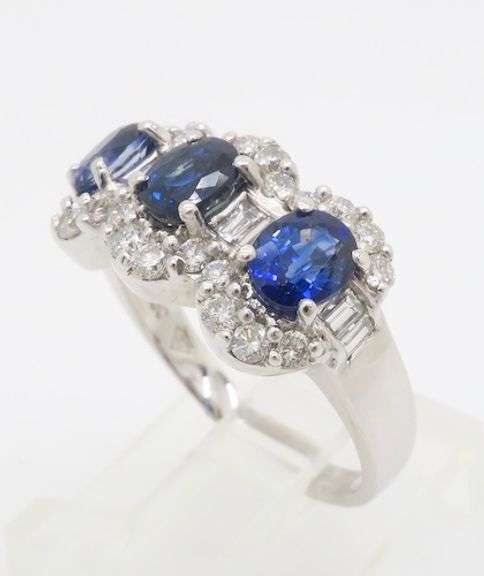 Three Stone Blue Sapphire & Diamond Halo Ring in 18k White Gold