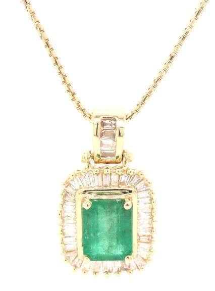 14kt Yellow gold emerald cut emerald in diamond halo pendant on chain