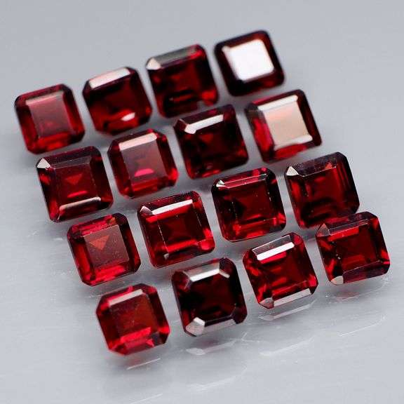 Impressive! 7.67ct emerald cut cherry red Garnet set!
