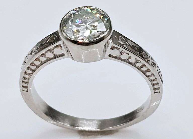 Sparkling 14 Kt White Gold Plated 1.5 Ct Lab Simulated Diamond Ring.
