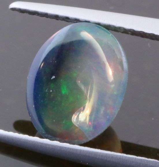 Exotic 1.95ct bi-color Ethiopian Black Opal cabochon