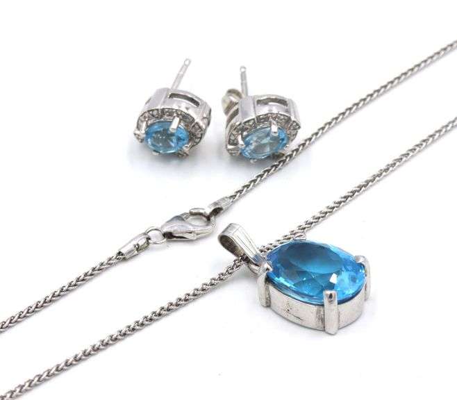 Set of 925 sterling silver blue zirconia pendant on chain and earrings