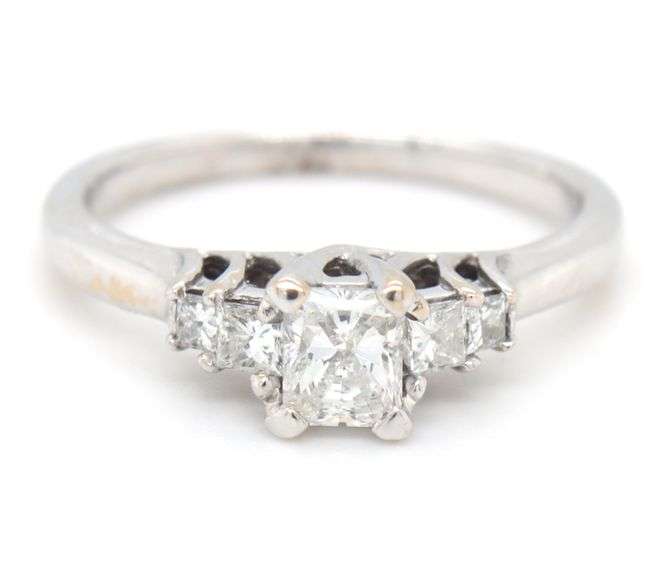 14kt White gold approximate 0.75ctw Radiant diamond with 0.25ctw Princess cut diamond ring