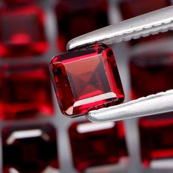 Impressive! 7.67ct emerald cut cherry red Garnet set!