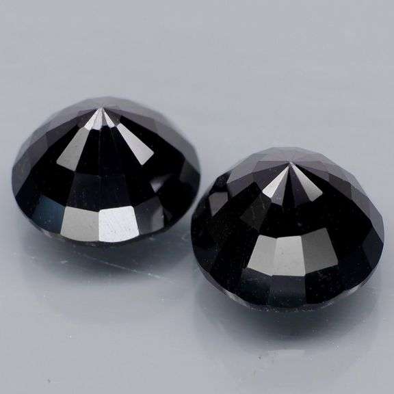 Matched 11mm pair of all black Tektite weighing 14.30 carats!