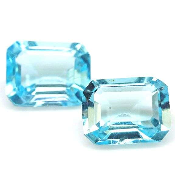 Dazzling 9.80ct vivid blue emerald cut Topaz pair
