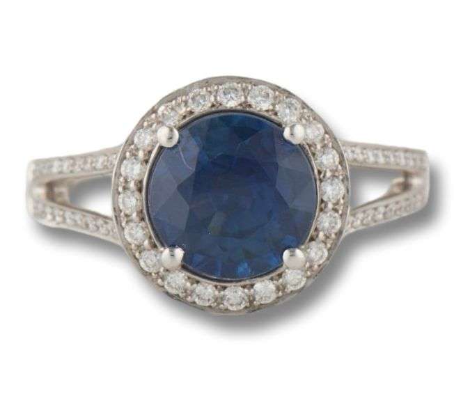 18kt WG Round Cut Blue Sapphire and Diamond Split Shank Halo Ring