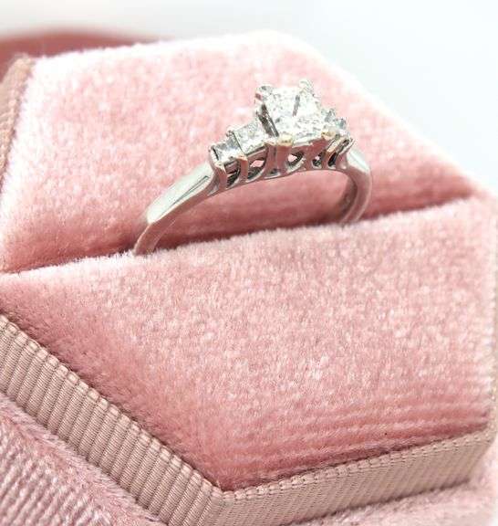 14kt White gold approximate 0.75ctw Radiant diamond with 0.25ctw Princess cut diamond ring