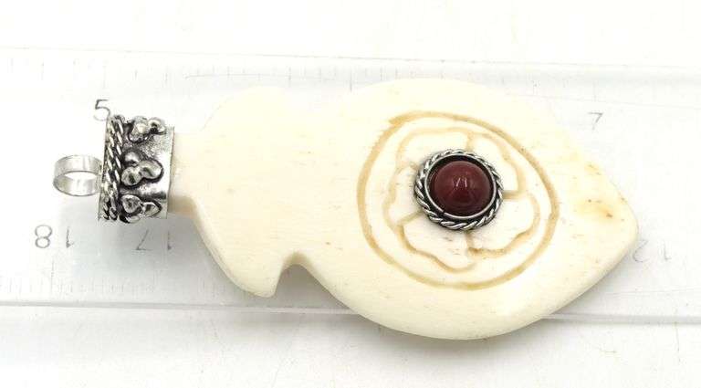 Tibetan carved bone feather pendant with red coral