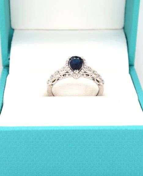 14kt White gold 0.90ct blue sapphire and diamond halo ring