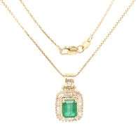 14kt Yellow gold emerald cut emerald in diamond halo pendant on chain