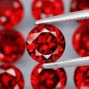 Glittering! 9.04ct UNTREATED cherry red Mozambique Garnet set