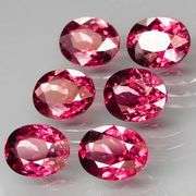 Amazing 8.96ct oval cut violet red Garnet set
