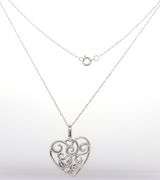 14kt White gold diamond swirl heart pendant on chain