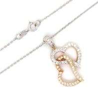 18kt two tone gold heart shaped diamond pendant on chain