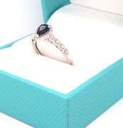 14kt White gold 0.90ct blue sapphire and diamond halo ring