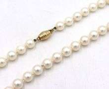 White fresh water pearl necklace with gold clasp