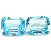 Dazzling 9.80ct vivid blue emerald cut Topaz pair