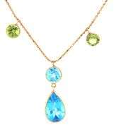 14kt Yellow gold pear shaped topaz and round peridot station necklace