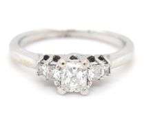 14kt White gold approximate 0.75ctw Radiant diamond with 0.25ctw Princess cut diamond ring