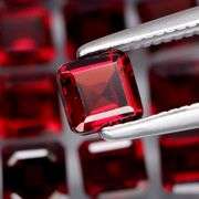 Impressive! 7.67ct emerald cut cherry red Garnet set!