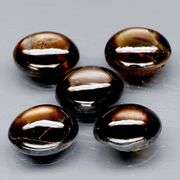 Natural 7.15ct set of golden black Star Sapphires