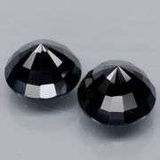 Matched 11mm pair of all black Tektite weighing 14.30 carats!