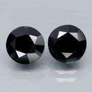 Matched 11mm pair of all black Tektite weighing 14.30 carats!
