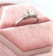 14kt White gold approximate 0.75ctw Radiant diamond with 0.25ctw Princess cut diamond ring