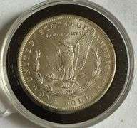 Frosty White BU 1884 O Morgan Dollar.
