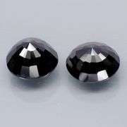 Matched 12mm pair of all black Tektite weighing 13.71 carats!