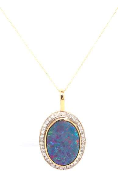 16kt Yellow gold large oval opal and diamond pendant on chain