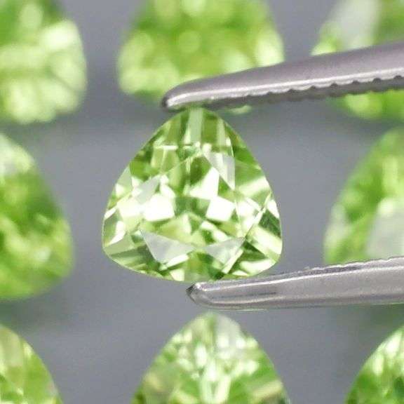 Fantastic 4.32ct 5x5mm trillion cut Peridot set