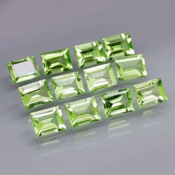 Brilliant 5.50ct 12pc set of matched baguette cut Peridot