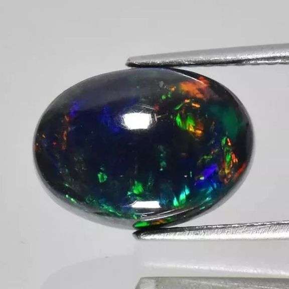 Glistening 2.31ct fiery flashing Welo Black Opal