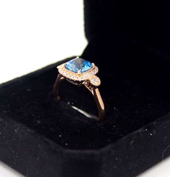 14kt Rose gold blue topaz & diamond Halo Ring