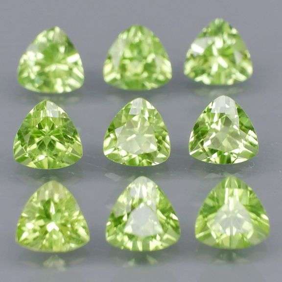 Fantastic 4.32ct 5x5mm trillion cut Peridot set