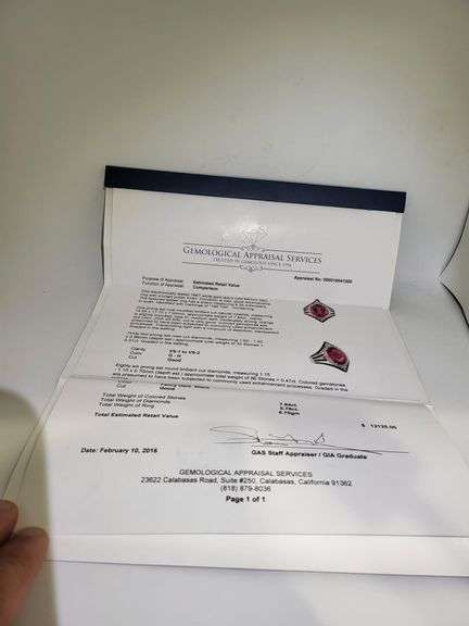 Striking 18K White Gold Halo Fashion Ring with 7.84 ct Oval Ruby and Diamond Accents