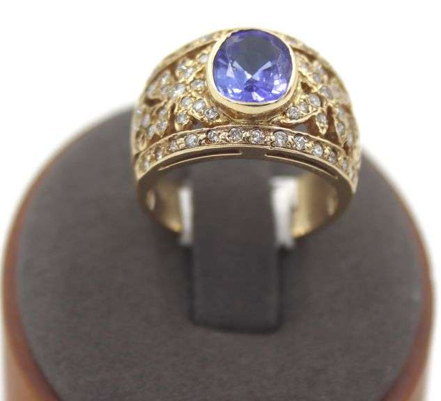 14kt Yellow gold 3.45ct Oval Tanzanite in Intricate Diamond wide setting