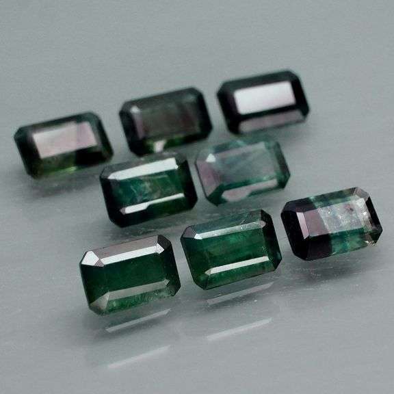 Stunning blue green 5.26ct emerald cut Sapphire set