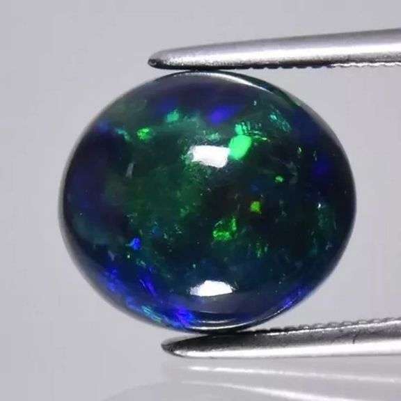 Magnificent 2.59ct full body flashing Black Opal
